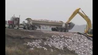 Side Dump Trailer Unloading Large Payloads [upl. by Wharton360]