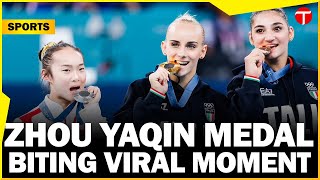 Zhou Yaqin Chinese gymnast adorable metalbiting moment goes viral at Paris Olympics 2024 [upl. by Ellerrad]