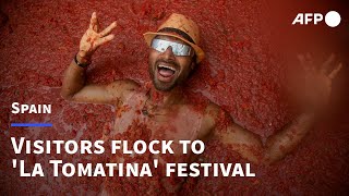 Visitors gather in Spain for La Tomatina festival  AFP [upl. by Boehmer]