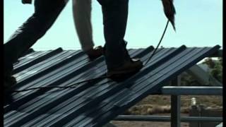 Metal Building Installation Step 19 Roof Panels [upl. by Anawot229]