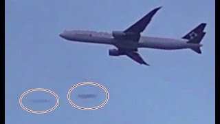 2 long Cigar Shaped UFOs flying at extreme speed by Plane over london UK [upl. by Laveen219]