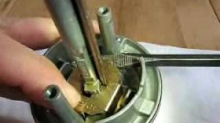 How to remove the lock cylinder from a Kwikset SmartKey entry knob [upl. by Lenzi800]