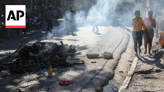 Bodies lie in the street after Haiti neighborhood targeted in gang attacks [upl. by Schellens]