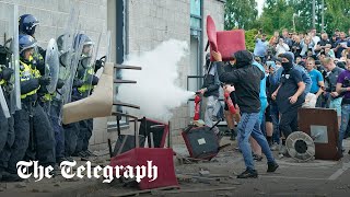 Antiimmigration protesters smash through migrant hotel in Rotherham [upl. by Aliekahs]