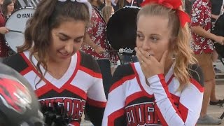 Football players kind gesture to cheerleader goes viral [upl. by Idnac]