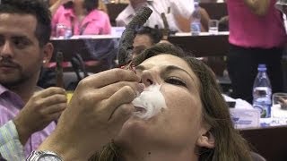 Cigar lovers compete for longest ash prize in Cuba [upl. by Aikenahs]