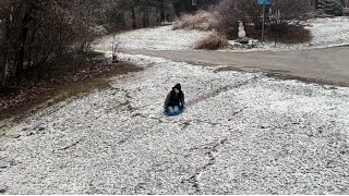 Sledding down a hill in new snow [upl. by Bettzel]