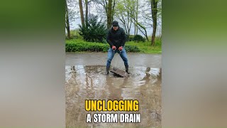 0372 Unclogging a storm drain after rain in Germany [upl. by Nosloc]