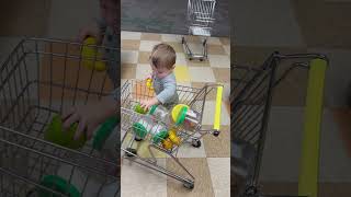 12424 Carson putting stuff into shopping cart at Iowa children’s museum [upl. by Aldrich]