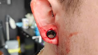 10mm biopsy punch tunnel dermal punch Extreme ear piercing streched ears Extreme Body Piercing [upl. by Nylloc]