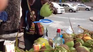 Fresh coconut water from a guy with all ten of his fingers [upl. by Ainesy422]