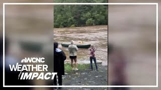 Caught on cam Man risks life to save woman from raging floodwaters [upl. by Eceinehs10]