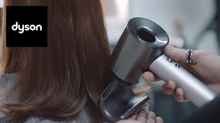 Using the attachments on the Dyson Supersonic™ professional hair dryer [upl. by Aplihs]