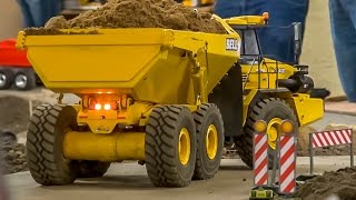 RC dump truck action at the construction site Bell amp Cat dumper at work [upl. by Janeen424]