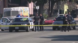 Deadly shootout breaks out in MidCity LA robbery lockdown at nearby school [upl. by Atcele]