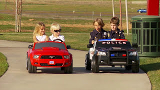 Power Wheels Race Police Dodge Charger vs Ford Mustang [upl. by Margery]