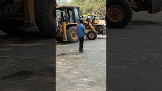 Worker hitching a ride on JCB outside construction site jcb construction rider workers [upl. by Letsirk868]