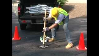 Contractors use US Cold Patch to repair asphalt potholes and cracks [upl. by Mauchi312]