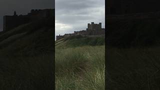 An iconic amp imposing castle that perches above Bamburgh beach on the Northumberland coast path [upl. by Annaet]