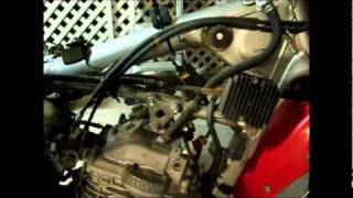 Acerbis 58 gal install XR650L part 1wmv [upl. by Ramin]