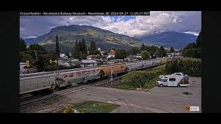 CPKC grain train with KCS heritage unit mid DPU at Revelstoke Railcam [upl. by Delmor]