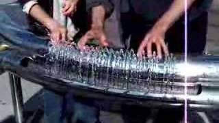 Two people playing hydraulophone water pipe organ flute [upl. by Kass]