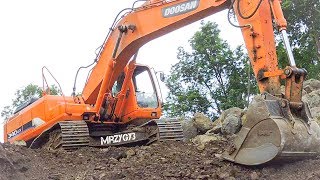 Large Digger Excavator Doosan Digging Loading Dirt Into Dump Truck [upl. by Ecreip]