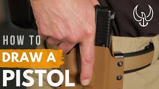 How to Draw a Pistol from a Holster  Navy SEAL Teaches Proper Pistol Draw [upl. by Ecilegna197]