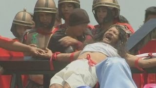 Good Friday crucifixion rituals Philippine devotees nail hands and feet to wooden crosses [upl. by Marlen]