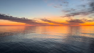 Sunrise and shimmers on Lake Michigan [upl. by Atsillac]