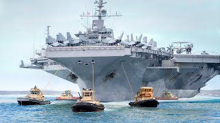 US Massive 100000 Ton Aircraft Carrier Moved by Tiny Tugboats From Port to Sea [upl. by Nara]