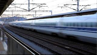 Shinkansen N700 series passing by another Shinkansen at Odawara Station Japan [upl. by Ronica431]