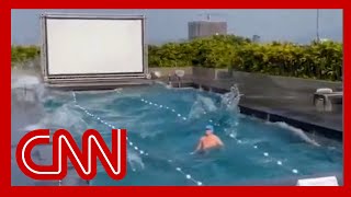 Video shows what happened when a man was swimming during the massive earthquake [upl. by Eninotna]