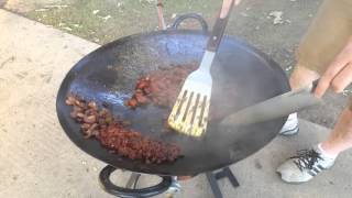 Jesse cooks on the cowboy wok cast iron plow share [upl. by Sucrad]