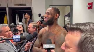 LeBron James watches Bronnys USC game while giving postgame interview 🎥  NBA on ESPN [upl. by Ecirual]