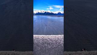 Surfers Ride Tidal Wave Bore Tide in Alaska for Miles alaska mountains surf ocean [upl. by Apthorp]