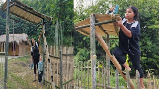 Young mother builds gate completes fence around house and takes care of child [upl. by Ylrebmit]