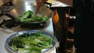 Cantonese Kitchen  Chinese cooking Sahng Choy Lettuce stir fried in a wok [upl. by Ylrebme]