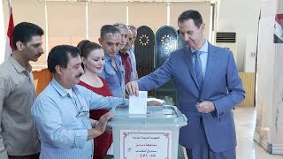 Syrias Assad casts his ballot in parliamentary poll  AFP [upl. by Oxford583]