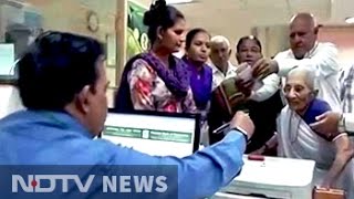 PM Modis Mother Visits Bank In Gandhinagar For New Currency Notes [upl. by Bathulda]