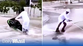 Thrill seeking Emiratis on jet skis swerve through Dubais flooded roads after heavy rains sink cars [upl. by Vanya]