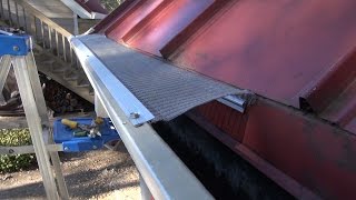 EasyOn Gutterguard Installing on standing lock metal seam roof [upl. by Enaz]