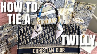 How to Tie A Dior Mitzah Scarf  Louis Vuitton Bandeau  Hermes Twilly on Dior Book Tote Bag Handle [upl. by Ahseiat823]