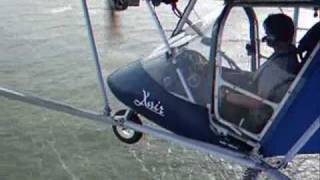 Microlight flying  low level along the Norfolk coast [upl. by Aljan]