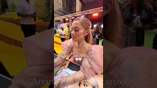 Ariana Grande DRAWS tattoos for fans at wicked premiere [upl. by Atinehc509]