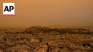 Athens Greece skies turn orange with dust clouds from North Africa [upl. by Grimaud]