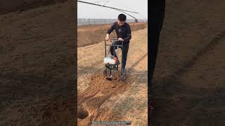 Drilling holes in the ground with a petrol drill [upl. by Anitneuq6]