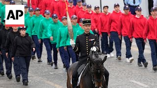 Bastille Day parade in Paris meets the Olympic torch relay [upl. by Rossner]