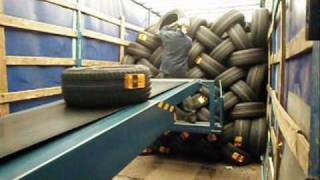 Telescopic conveyor unloading tires and cartons  LOADmaster [upl. by Yellat]