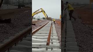 Excavator installing metal beam of railroad [upl. by Towbin]